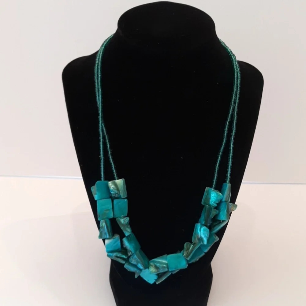 2 strand shell like turquoise necklace.